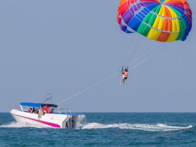 Parasailing behind boat