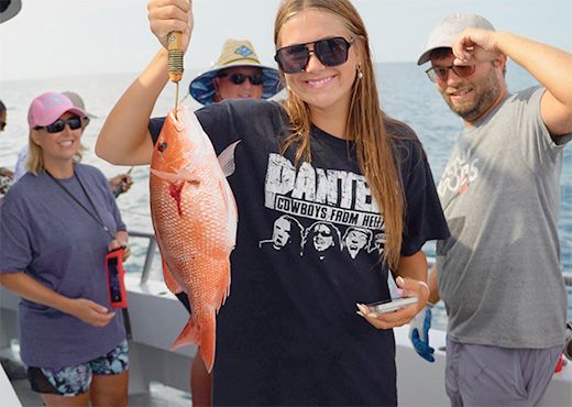Woman holding a caught fish