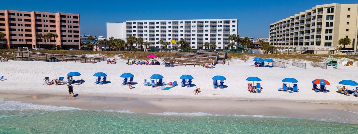 Beachfront condos with umbrellas & chairs facing the water family-friendly vacation rentals Holiday Isle Destin Florida 